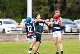 Hampden East under 17 player Ryan Mottram contests the ball against the Warrnambool and District league on Sunday. Pictures by Anthony Brady