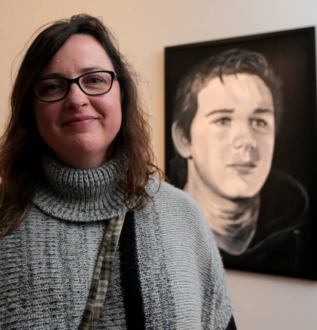 Chosen: Liz Gannon with her portrait of Cooper Lower that won this year's People's Choice award. The portrait was Ms Gannon's first entry in a big art competition. 