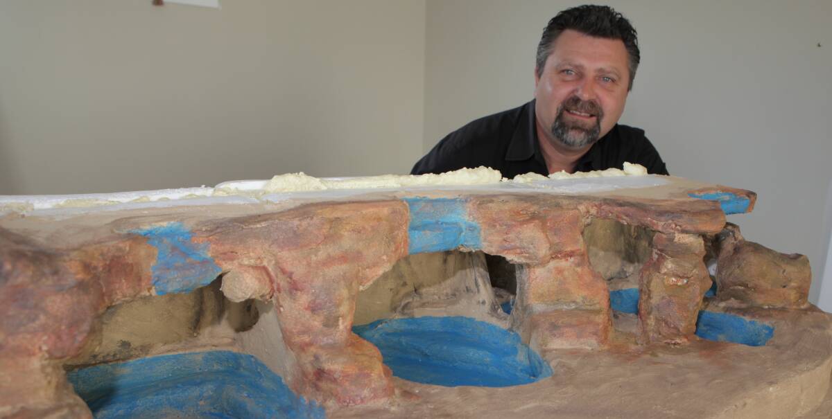Vision: Great Ocean Road Hot Springs co-proponent Gene Seabrook with a model of some of the geothermal pools the project aims to create at the Deep Blue hotel property. 