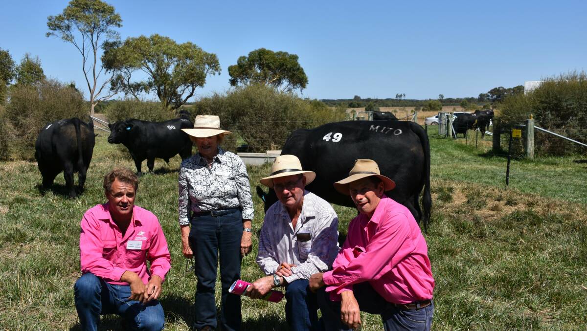 Selling well: Te Mania's Tom Gubbins with the buyer of $32,000 top-priced bull, Betty Roche, of Arden Angus, Adelong, NSW, and Gerald Ryan and Hamish McFarlane.