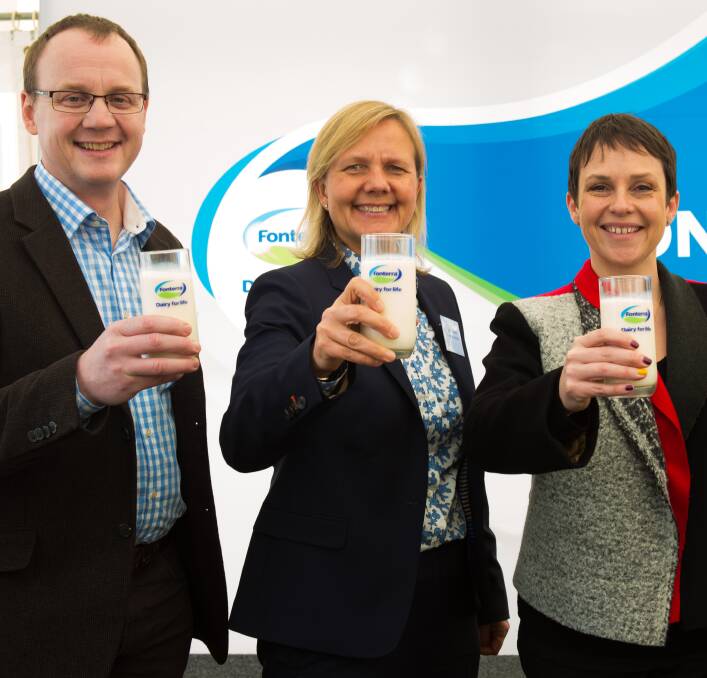 Cheers: Woolworths' Ewan Shearer, Judith Swales from Fonterra and state agriculture minister Jaala Pulford toast the opening of Fonterra's Cobden milk plant. 