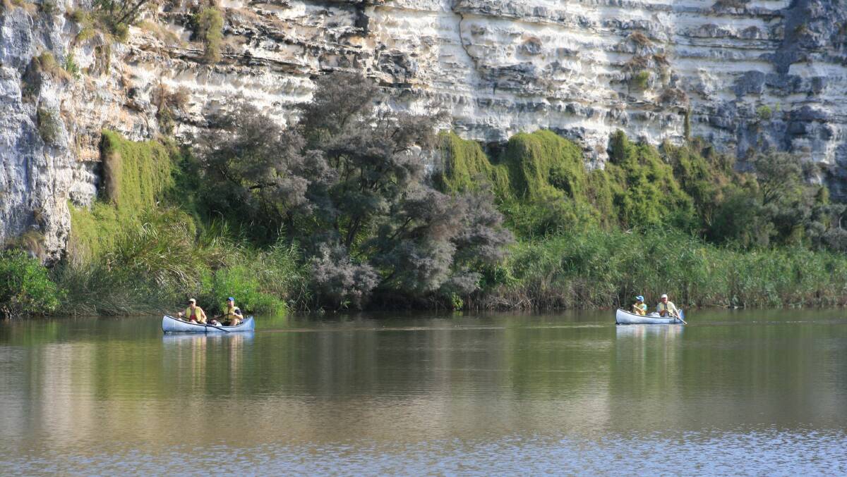 Canoeists paddle through the spectacular Glenelg River gorge. Picture: Lynn Gunning. 