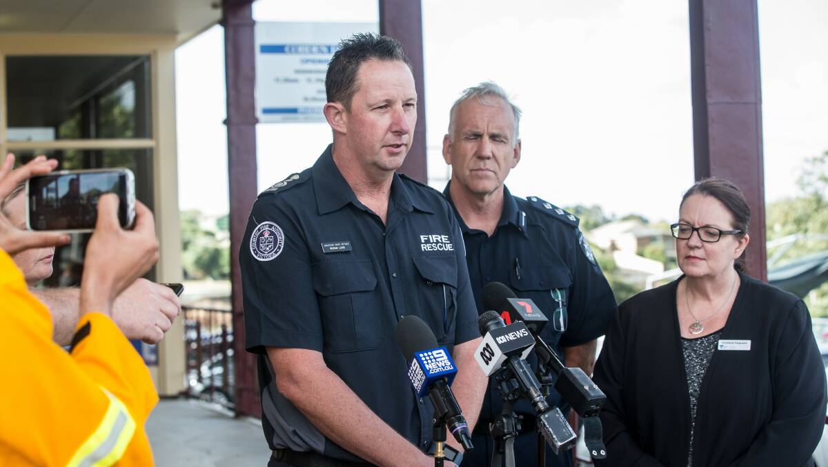 CFA south-west assistant chief officer Rohan Luke, left, speaks to the media prior to a community meeting at Cobden on the weekend's bushfires.