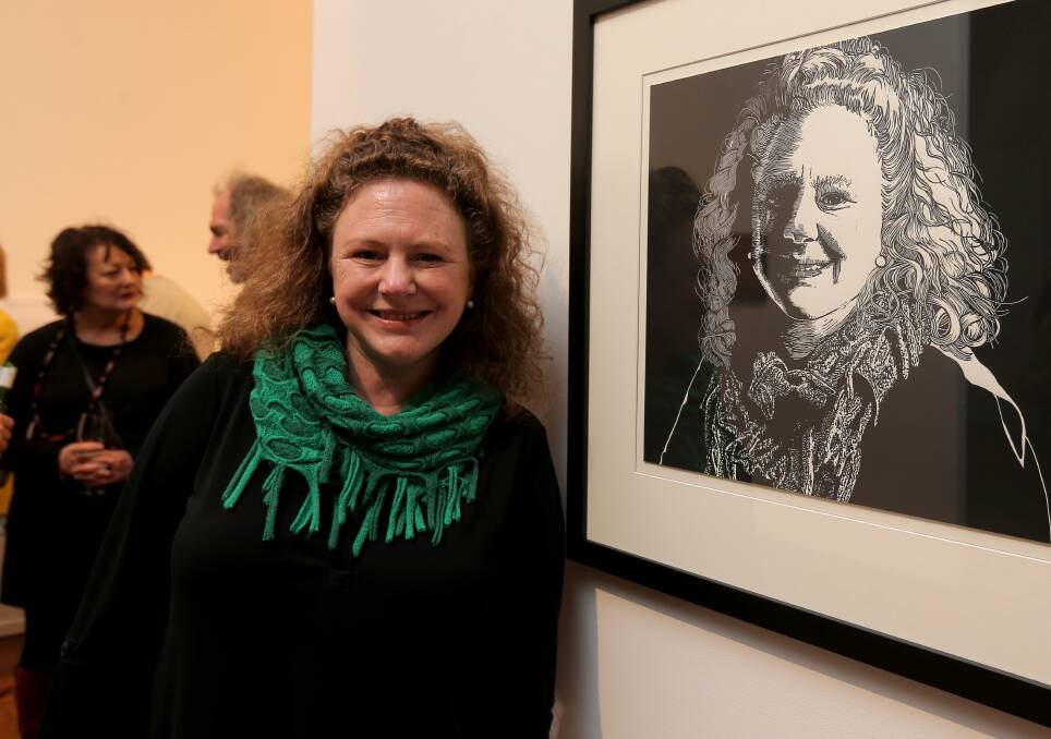 Captured: Warrnambool mayor Kylie Gaston with the portrait of her that was an entry in this year's Warrnibalds.