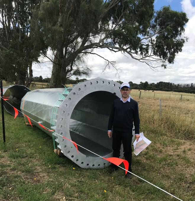 Concern: Member for Polwarth Richard Riordan with one of the large towers being installed to carry transmiussioin lines from the Salt Creek wind farm near Mortlake.  