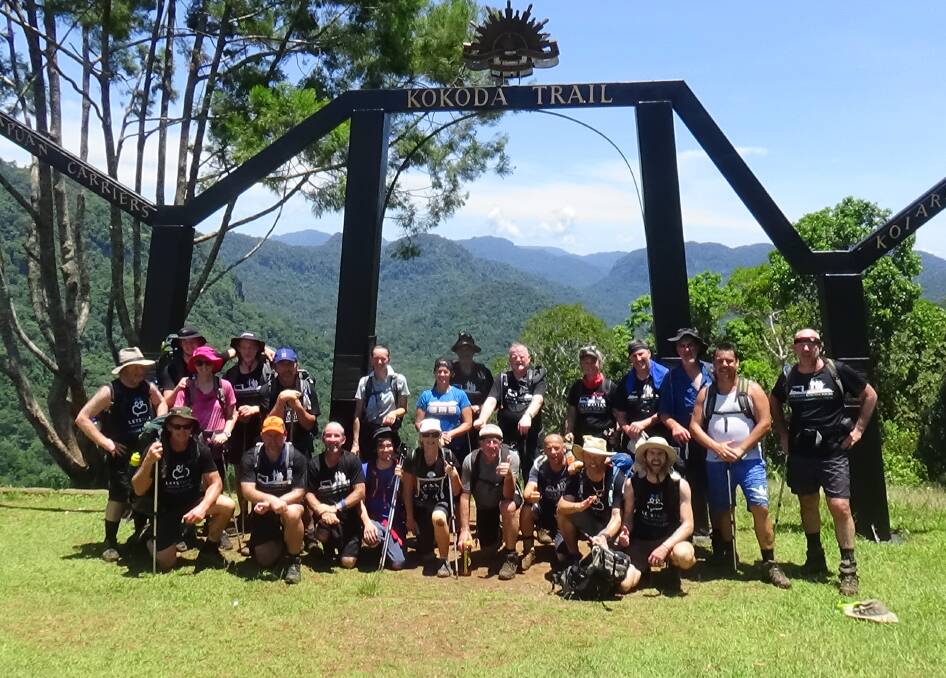 Achievement: Let's Talk walkers at the finish of the Kokoda Trail. 