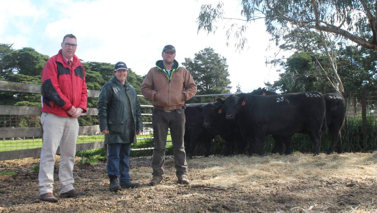 Sale: Ross Milne, Wendy Kelly and Chris Robinson, who bought an $8000 bull. 