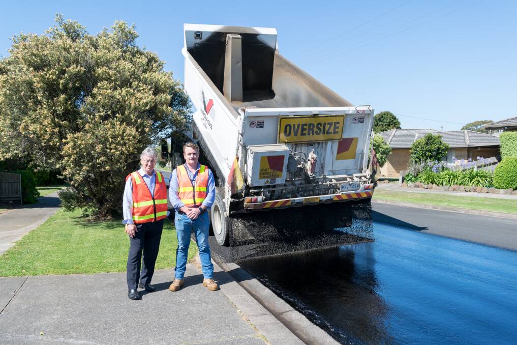 RENEWED STREETS: Warrnambool City Council mayor Rob Anderson with construction supervisor Abel Farrell on Couch Street, where resealing works are underway. 