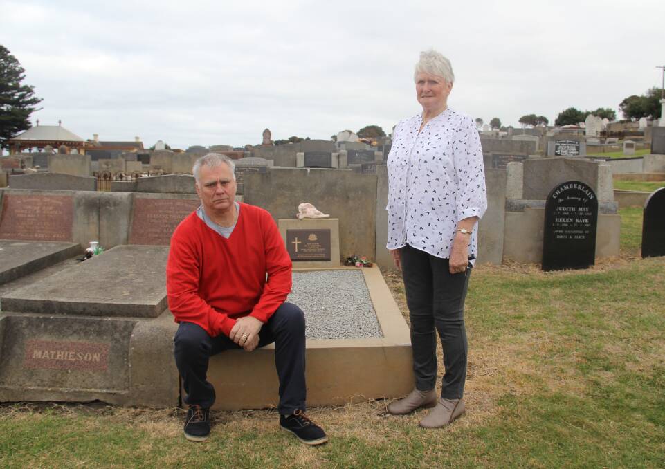 NEVER FORGOTTON: Private William Carroll's son David and wife Lorraine stand next to his grave at the Warrnambool Cemetery during a tour on Anzac Day. Picture: Rachael Houlihan 