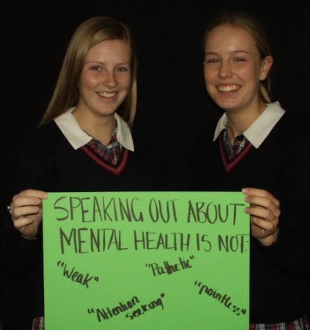 TIME TO TALK: Emmanuel College year 11 students Chelsea Hodgins and Amelia Quinlan with their message about mental health.