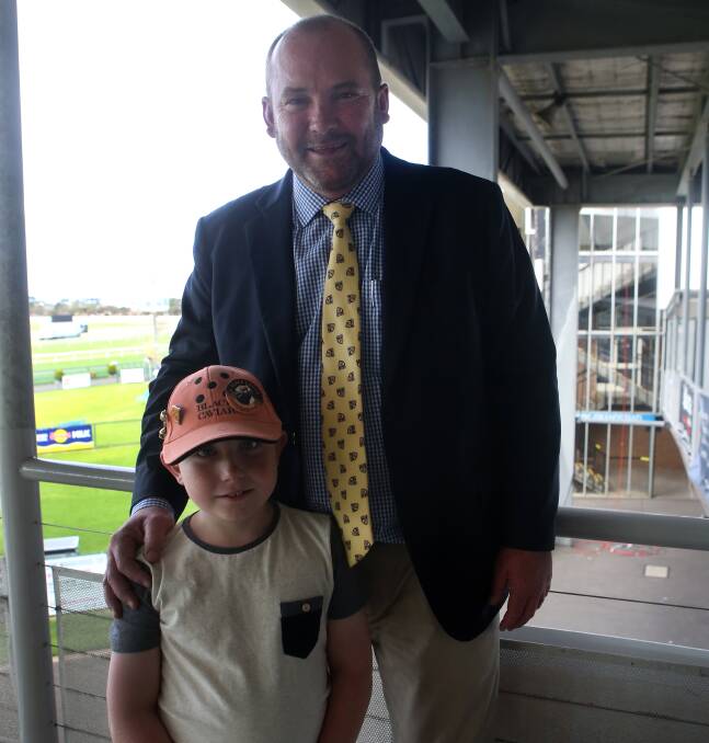 DAY OFF SCHOOL: Guest speaker and Black Caviar's trainer Peter Moody with longtime fan Lewis McCombe, 7, from Warrnambool. Picture: Amy Paton