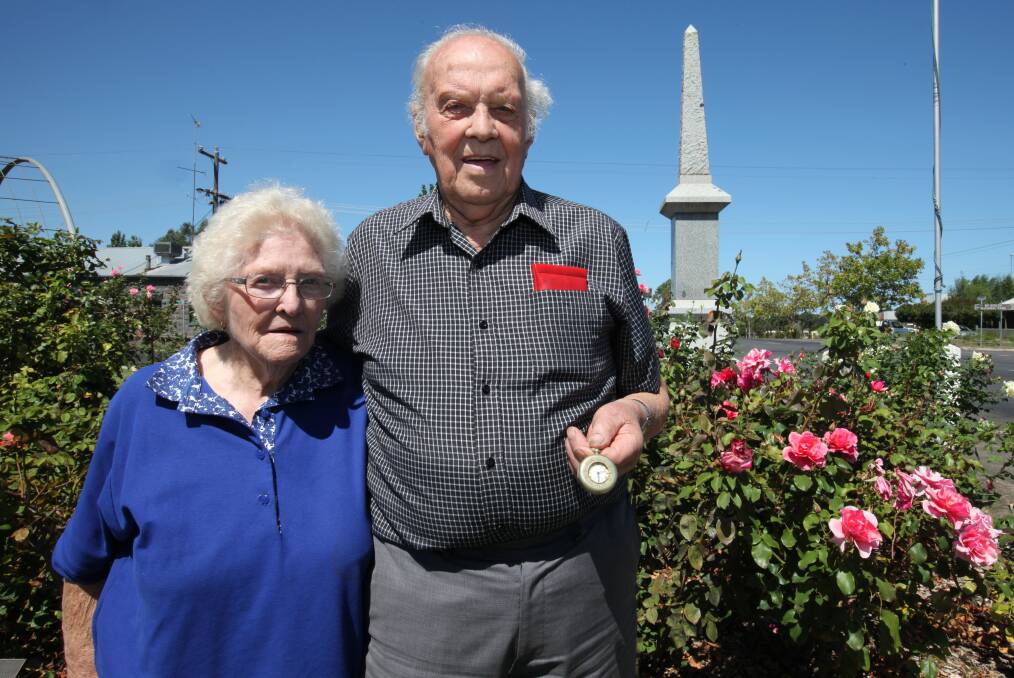 MISSING: Macarthur's Pat and Jack Bunworth at the town's war memorial. Mr Bunworth holds the watch that has been in his family's possession since World War I. Picture: Rachael Houlihan