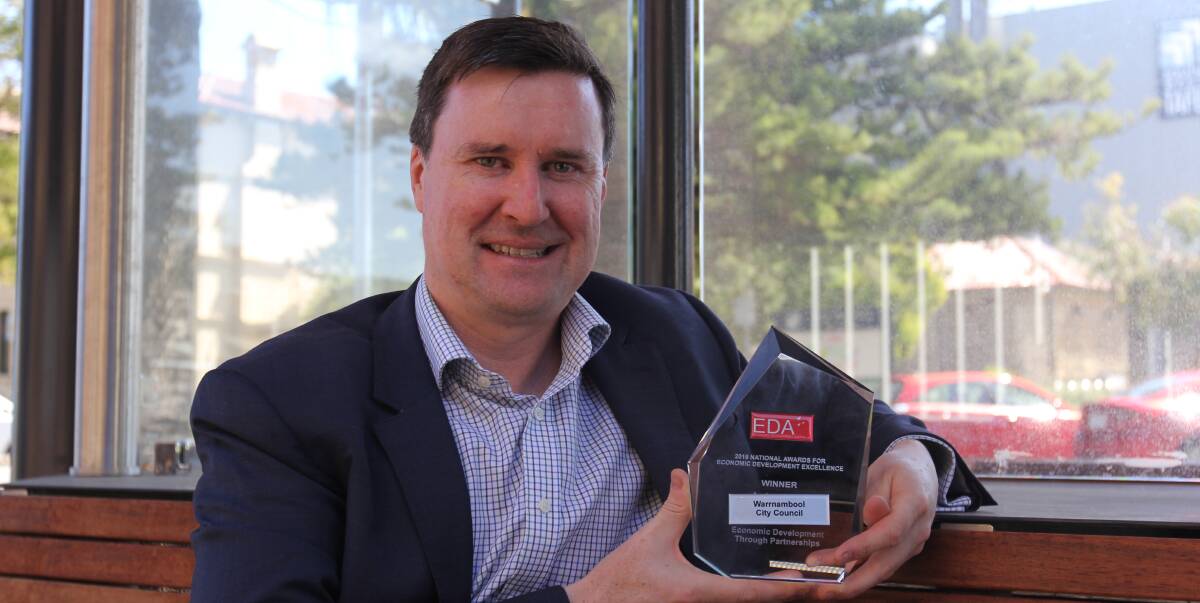 FIRST PRIZE: Warrnambool City Council director of city growth Andrew Paton with the Economic Development Australia award, which was awarded at a gala dinner in Perth.