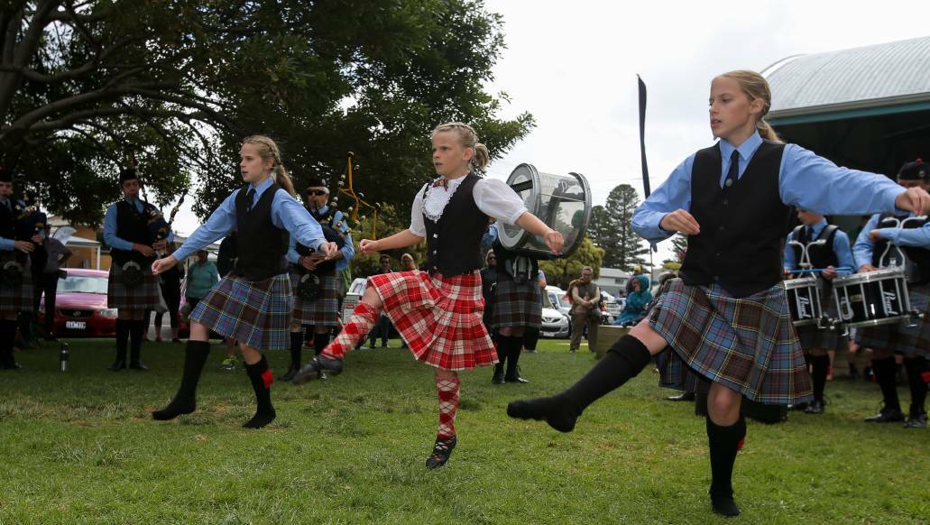 Dancers Eva Ryan, 9, Dana Russell, 9, and Faith Ryan, 12, and the Warrnambool Pipe Band members perform at the Moyneyana Celtic Day celebrations. 