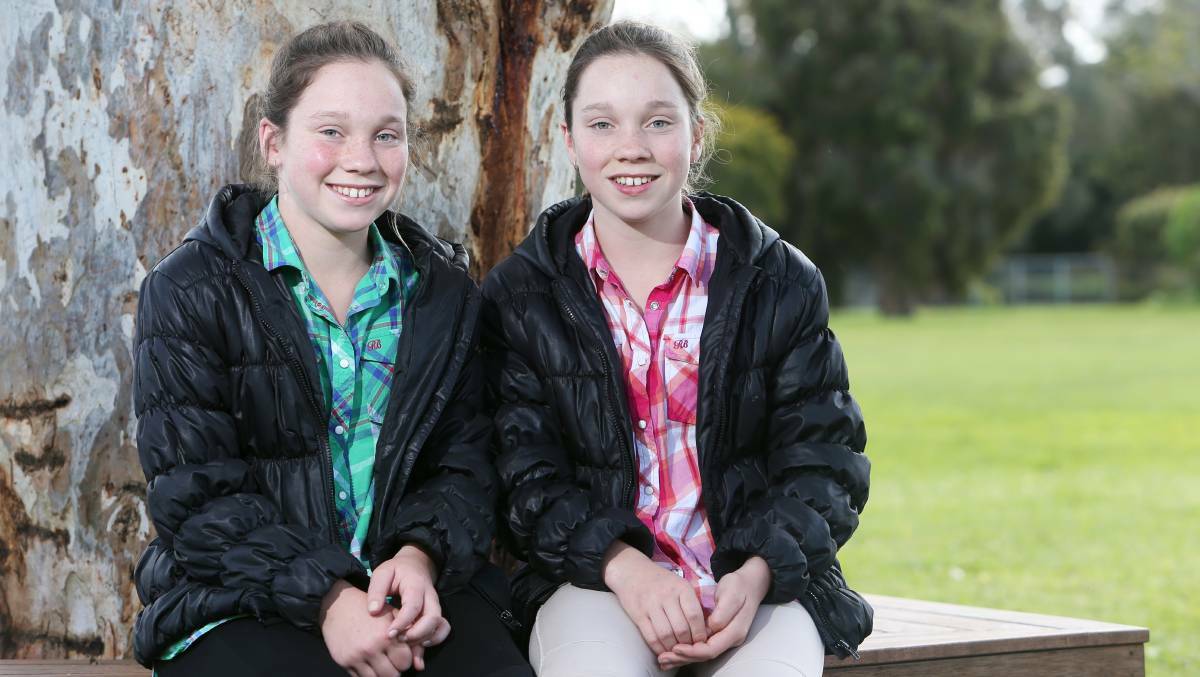 HONEST: Kaitlin and Sophie Parfrey, 11, found $1450 on their way to school in Macarthur and handed it in to the police. Picture: Rob Gunstone