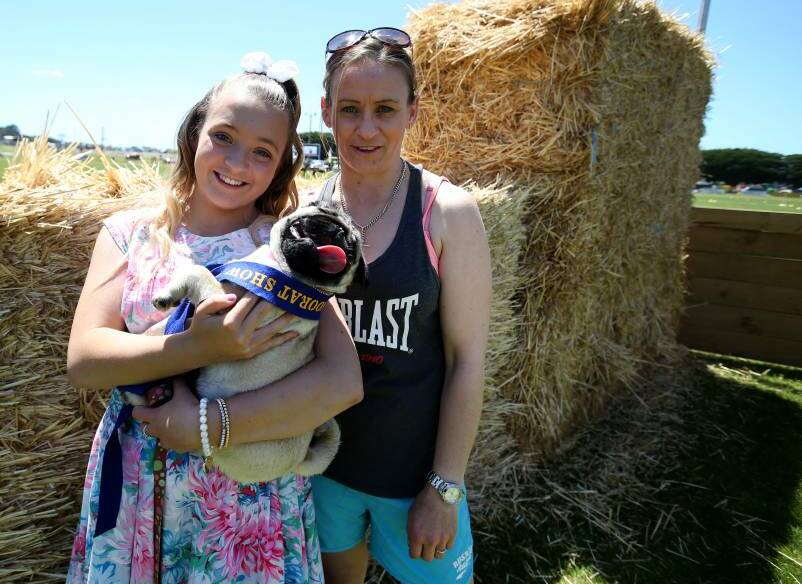 Learna Beare, who won Miss Show Person in the 13-16 year old category, with her mother Melissa, and pug puppy Boni, six months, who won Best Parader.