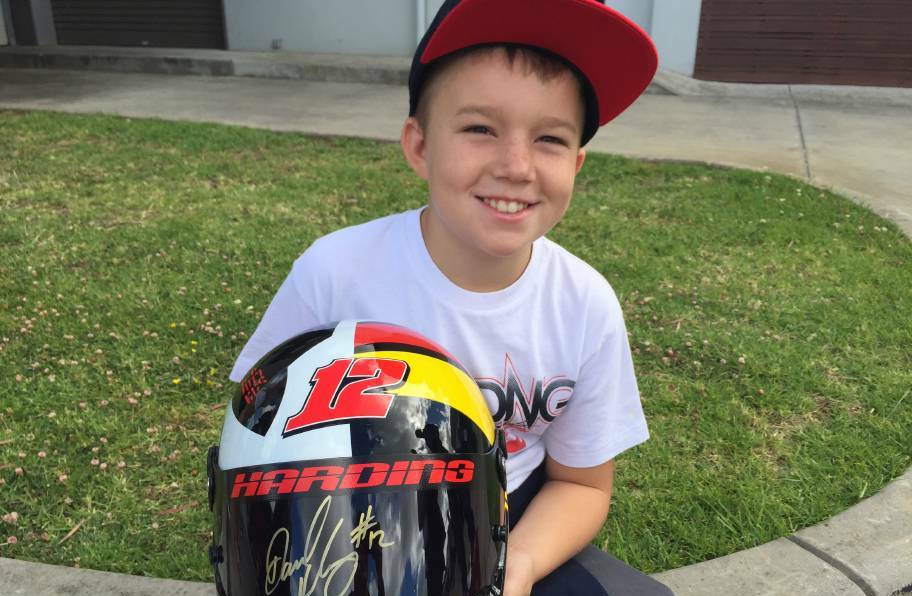 Deegan Bellinger, 10, from Tasmania is all smiles at the speedway fan appreciation day