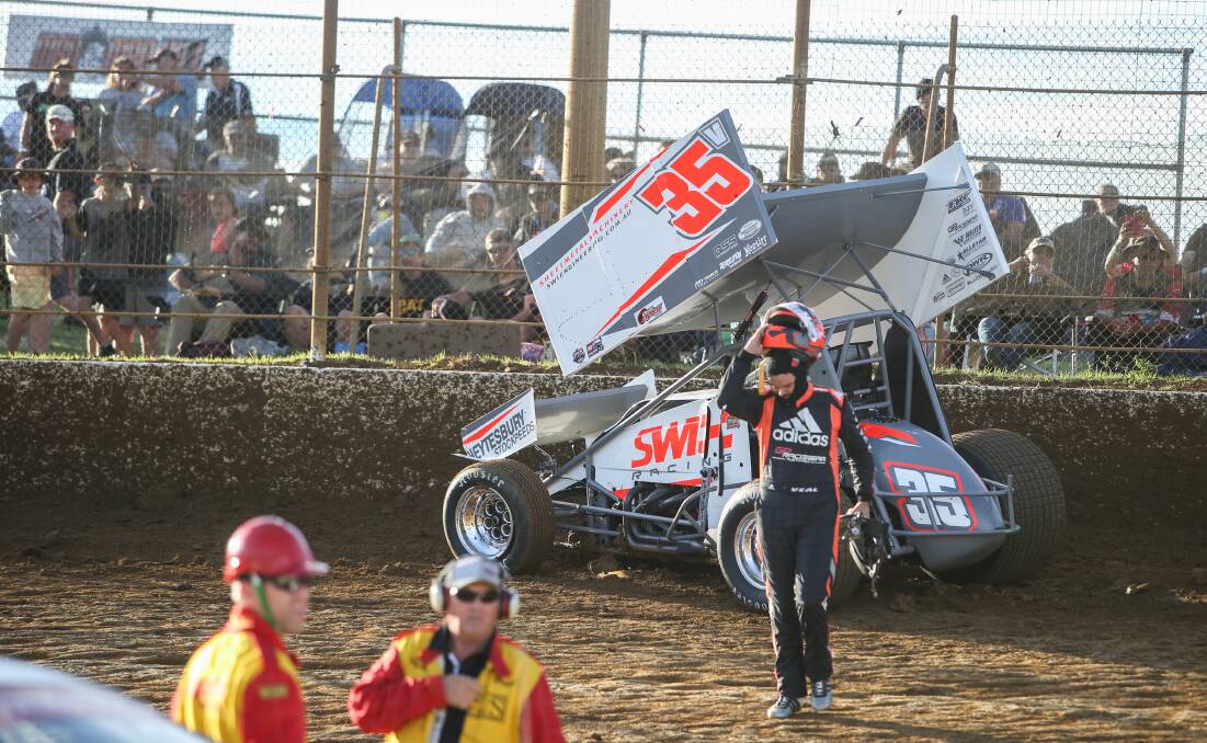 Warrnambool's Jamie Veal leaves his car after crashing in the first corner of his heat. Picture: Amy Paton