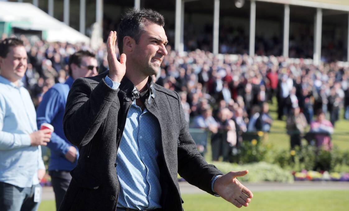 Yee-ha: Warrnambool trainer Symon Wilde cheers on Gold Medals in the first race on Thursday. Picture: Rob Gunstone