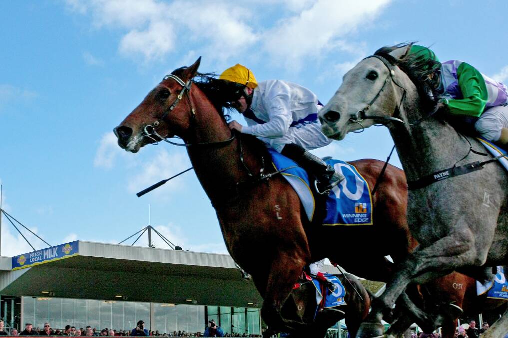 Tennessee Pulse (Ryan Moloney, outside) flashes past Our Guarantee (Michelle Payne) on Wednesday.