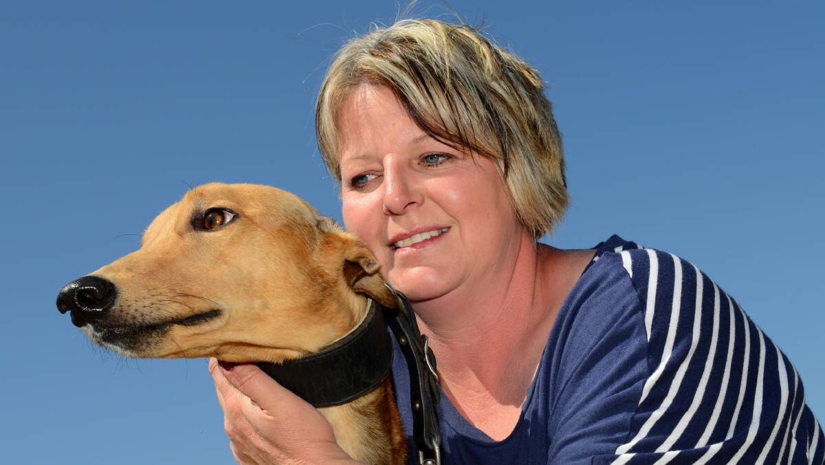 Star sprinter Kayda Shae with kennel forewoman Kelly Bravo. The gun chaser may have run his last race.