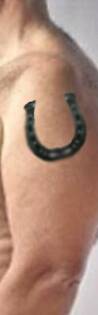 A photofit image of his distinctive horseshoe tattoo.