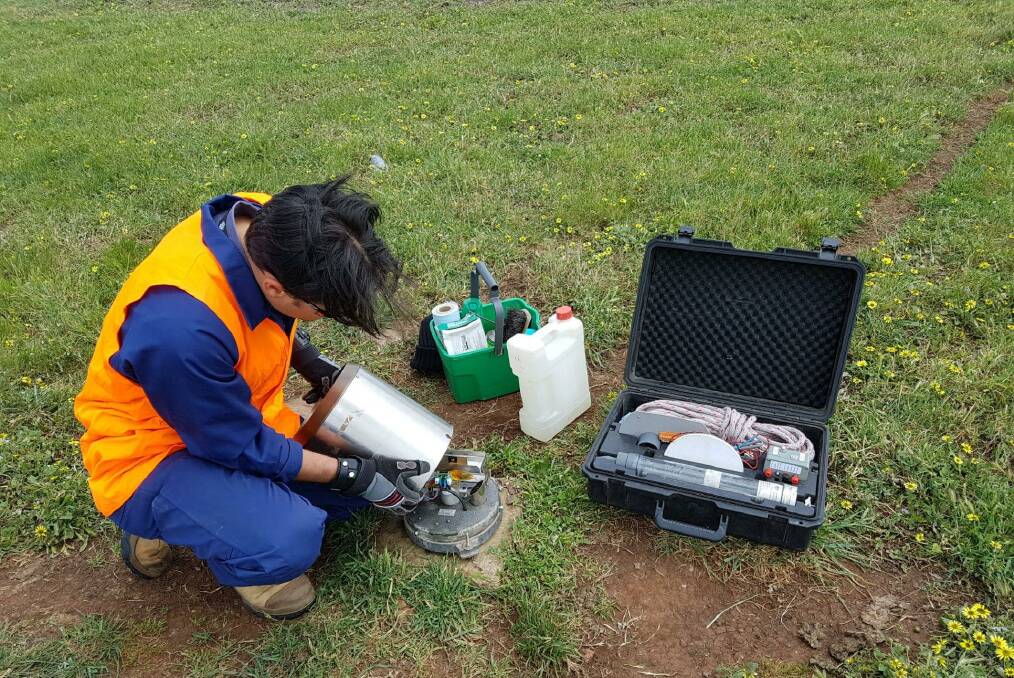 Check-up: A BOM technician replaces the damaged Mount Gillibrand equipment. Picture: BOM