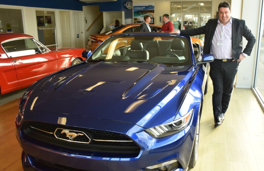 NEW RIDE: Norton Ford Warrnambool sales manager Shaun Noonan with the Ford Mustang, which arrives in Australia in October. Picture: Jono Pech