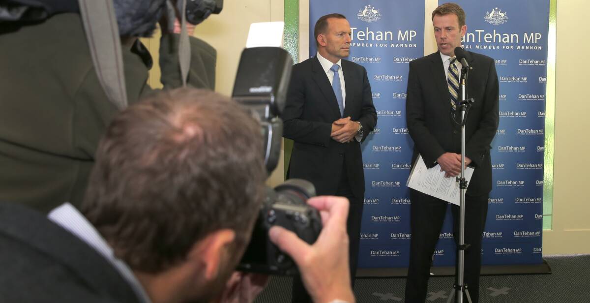 FRENZY: A media flurry chased Tony Abbott, pictured with Member for Wannon Dan Tehan, during the leader's regional stay. Picture: Rob Gunstone