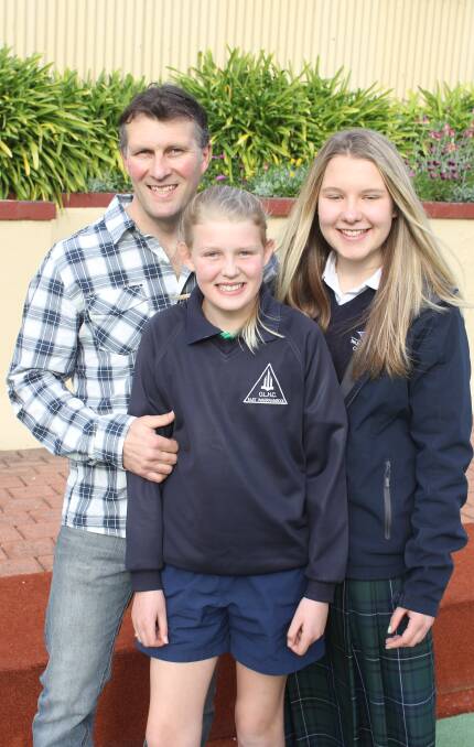 ALWAYS THERE: Warrnambool's Jai Russell with daughters Nikayla, 11, and Shearna, 14, after being named South West Victoria Father of the Year. Picture: Jono Pech