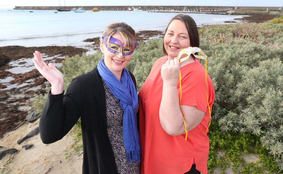 READY: Rebecca Ross and Sarah Dunn try on their masks ahead of the Masquerade For MND ball, raising money for motor neurone disease. Picture: Amy Paton