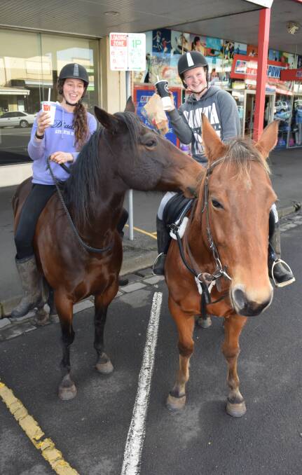HUNGER GAMES: North Warrnambool residents Ebony Porter, 20, and Tamika Cooper, 15, rode into the city for some fast food on Wednesday. Picture: Jono Pech