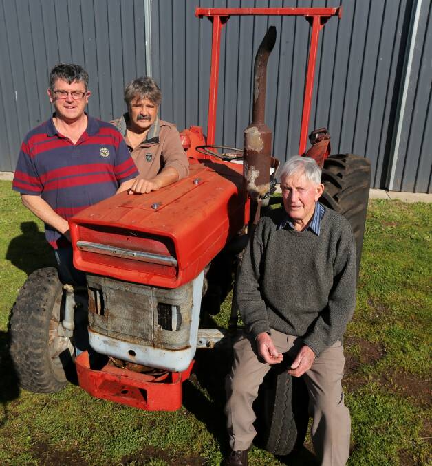 NEW LIFE: Rotarians Ian Watson, Tony Austin and Graeme Ross with the Massey-Ferguson 135 tractor, which will be shipped to Papua New Guinea through the Rotary Australia World Community Service Project. Picture: Rob Gunstone