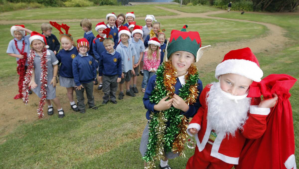 Carols on the Merri: Elf Pippa Grimshaw, 6, and Santa Jacob Hose, 5, and the students from St Johns Primary School are excited about performing at the Carols on the Merri. Picture: Rob Gunstone