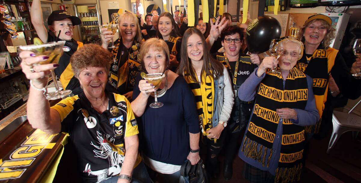 BIG NIGHT: Lois Knight (front) left enjoys a "Dustin Martini" drink with her friends at Campbells Creek's Five Flags Hotel on Monday night. Lois knew from the age of five that her grandson Dustin Martin would be a star. She was right - he's now a Brownlow medallist. Picture: GLENN DANIELS