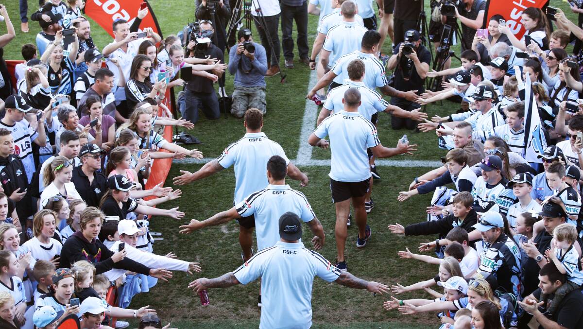 Fans cheer as the Sharks arrive during a Cronulla Sharks NRL fan day at Southern Cross Group Stadium on September 27, 2016 in Sydney, Australia. Photo: Matt King/Getty Images