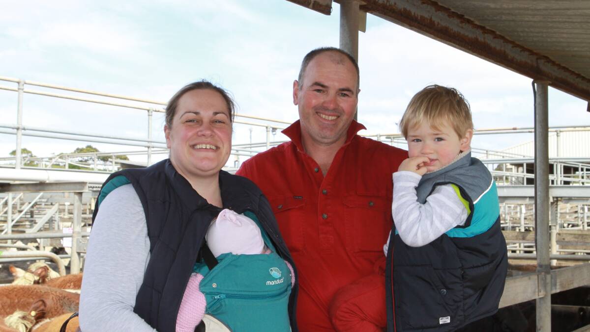 Hawkesdale farmers Richard and Caroline McRae with their son Blake, 2, and 11-week-old daughter Tess.