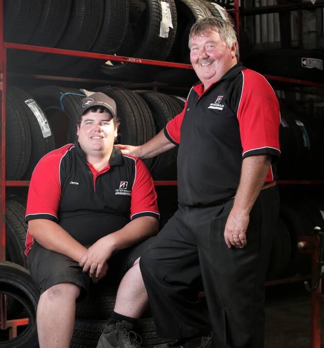 Driving success: Peter Baulch, pictured right, with son Jamie. 