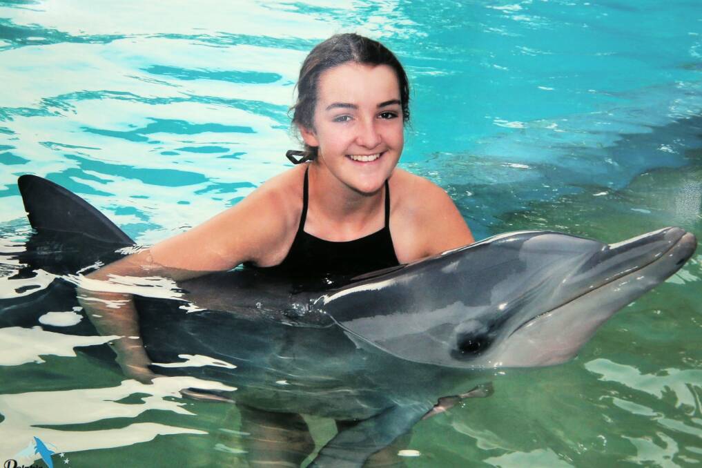 Experience of a lifetime: Jade McNeil, 15 from Brauer College has spent one week of work experience with dolphins in Coffs Harbour, NSW. Picture: Supplied