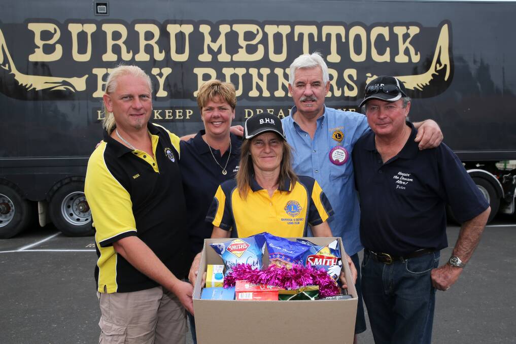 (from left to right) Mark Ryan of Katamatite, Mandy Hawke of Ritchies IGA Cobram, Linda Ryder of Barooga, Archie Howden of Strathmerton, and Peter Edwards of the Burrumbuttock Hay Runners. 