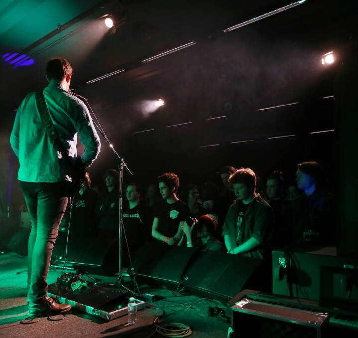 BATTLE FRONT: The punters get up close and personal for Warrnambool rock band The Mellows at Friday's battle of the bands at the Lighthouse Studio. Picture: Amy Paton.