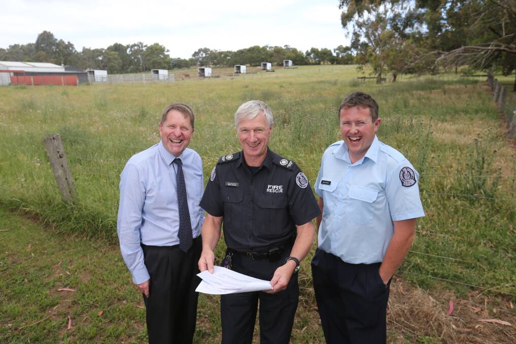 Moyne Health Services chief executive David Lee, the CFA's Henry Barton, and Koroit CFA captain Leigh Mugavin at the site of the new station last year.