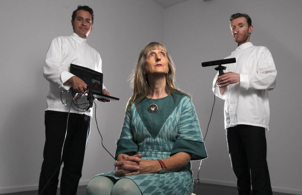 SCANNERS: Warrnambool artist and arts advocate Helen Bunyon (centre) sits for her 3D portrait with artists Jesse Stevens and Dean Petersen. Picture: Rob Gunstone