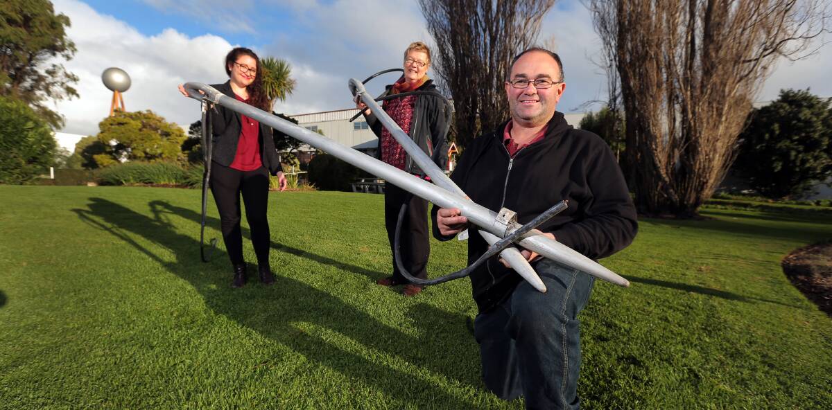 GOOD YARN: WAG director Vanessa Gerrans, Julie Eagles of FJ Stories, and site manager Troy Kelly with the returned needles. Picture: Rob Gunstone