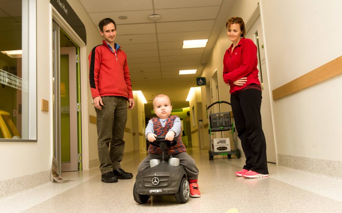 LITTLE BATTLER: Charlie Ciavarella with parents Tony and Merryn at the Royal Children's Hospital. Picture: Justin McManus, The Age.