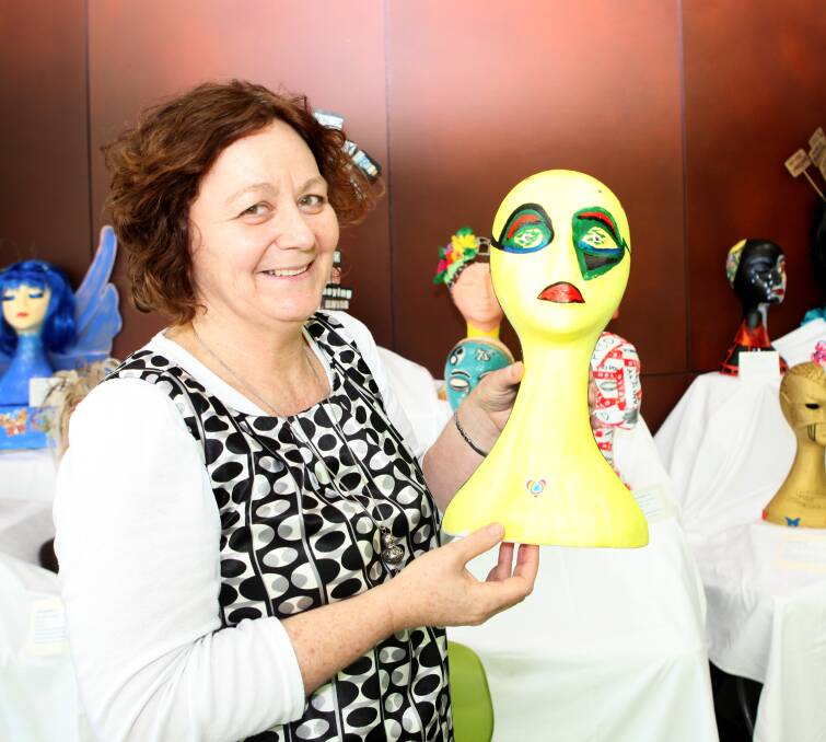 TALKING HEADS: South West Healthcare's Maureen Jubb-Shanley with one of the mannequins entered in the exhibition at the Warrnambool Base Hospital foyer. Picture: Matt Neal