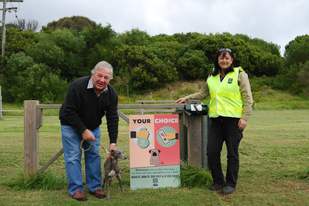 Mayor Jim Doukas and local laws officer Kim De Martin are urging Port Fairy dog owners to scoop their dogs' poop or get a $100 fine.