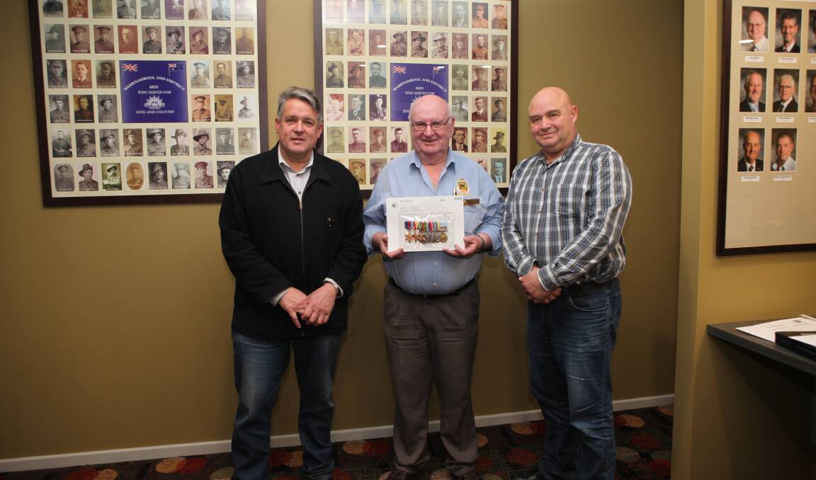 MEDALS OF HONOUR: Purnim Community Group member Geoff Rollinson, Warrnambool RSL president John Miles, and Moyne Shire small towns development officer Craig Midgley with Captain Reg Saunders' medals.