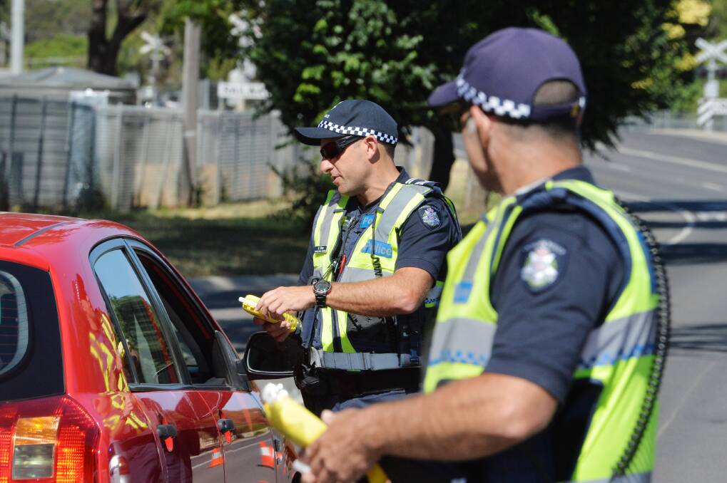 All policing units will be carrying out random breath tests this long weekend. Picture: DARREN HOWE