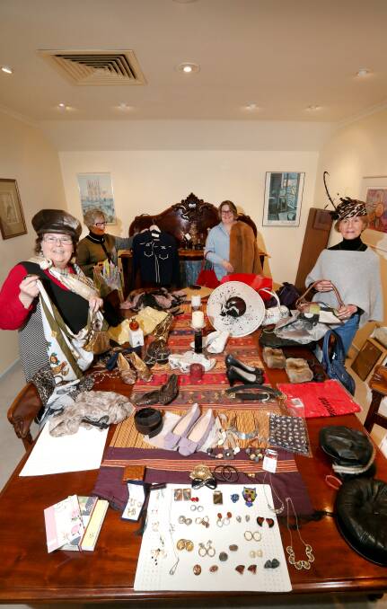 Fashion: Auxiliary members Carolyn Monaghan, Alison Northeast, Susie Alexander and Phillipa Caulfield with some of the items available at the auction. Picture: Amy Paton